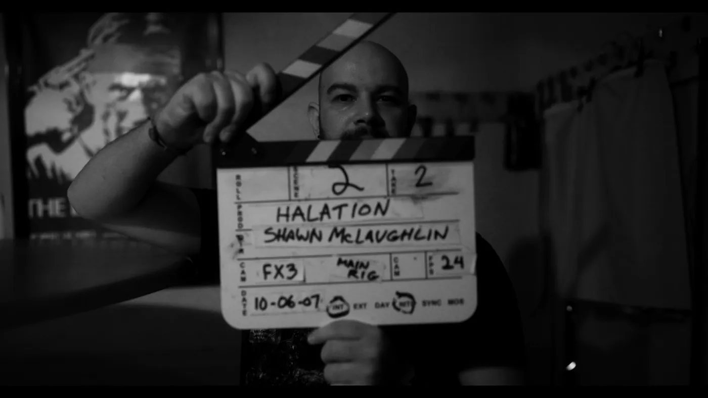 The HALATION slate on set, in black and white
